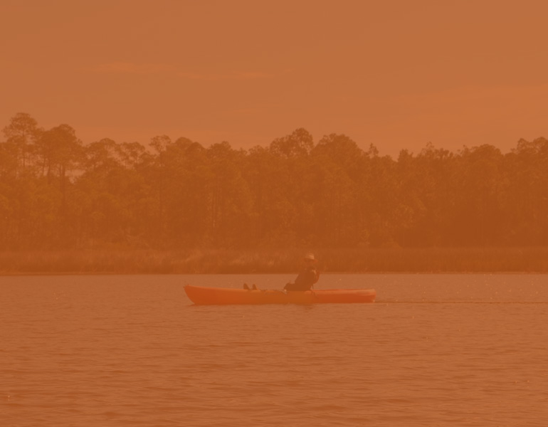 person in kayak in bayou